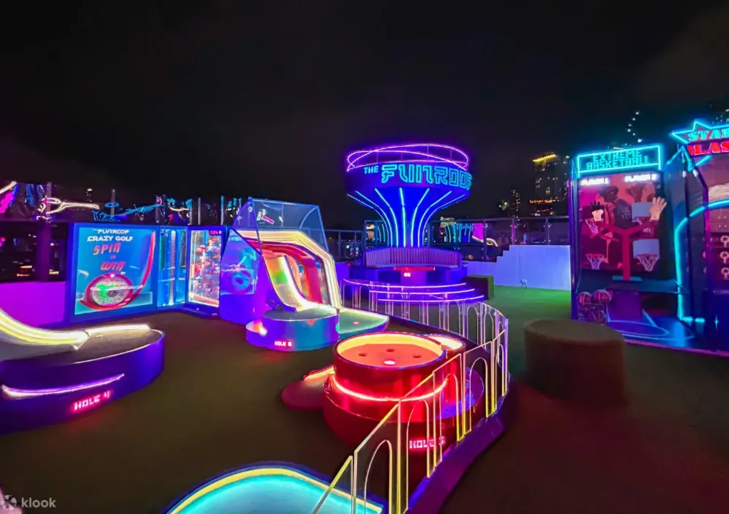 Neon mini golf and basketball games on The Fun Roof